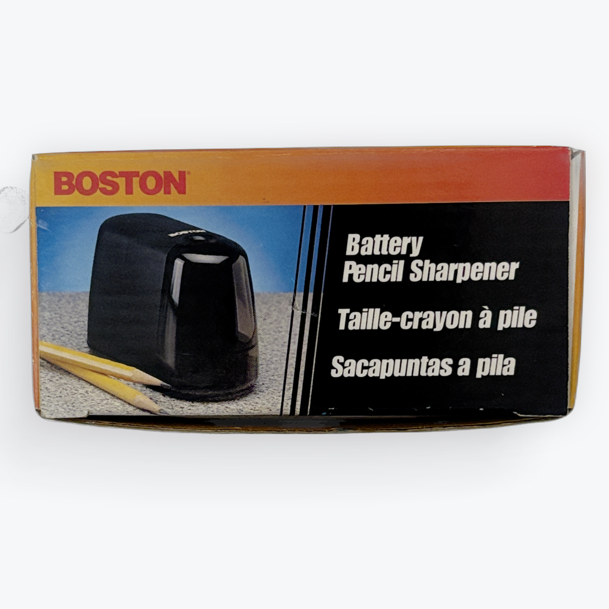 Boston battery pencil sharpener in its original retail packaging, featuring a black product photo on a box with orange, red, and black panels.