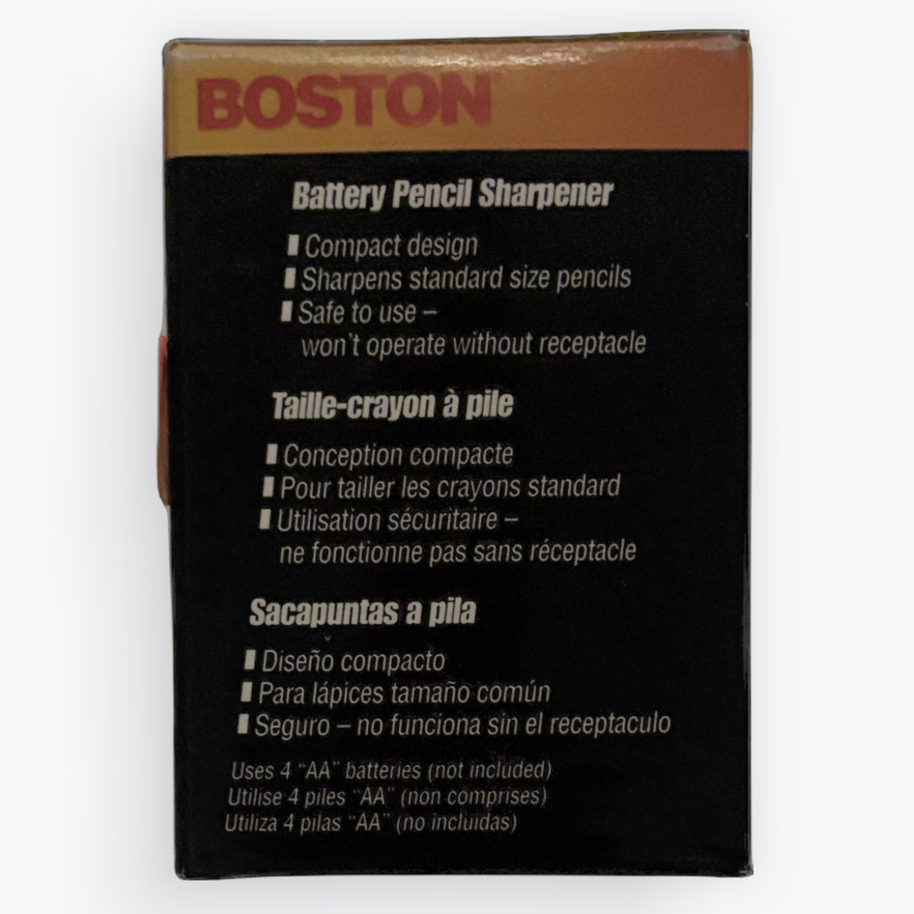 A boxed Boston Battery Pencil Sharpener shown from the back on a plain white background. The packaging is mostly black with a brown top section and red BOSTON branding, plus white text listing features in English and French.