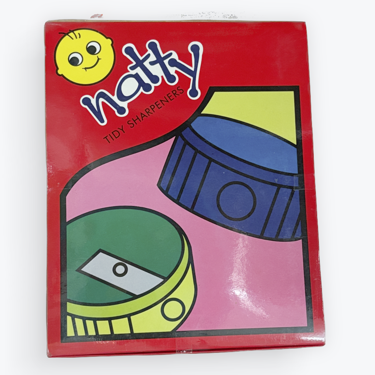 A red box of 'natty' brand tiny sharpeners, featuring a colorful illustration of two sharpeners and a yellow smiley face logo on a white background.
