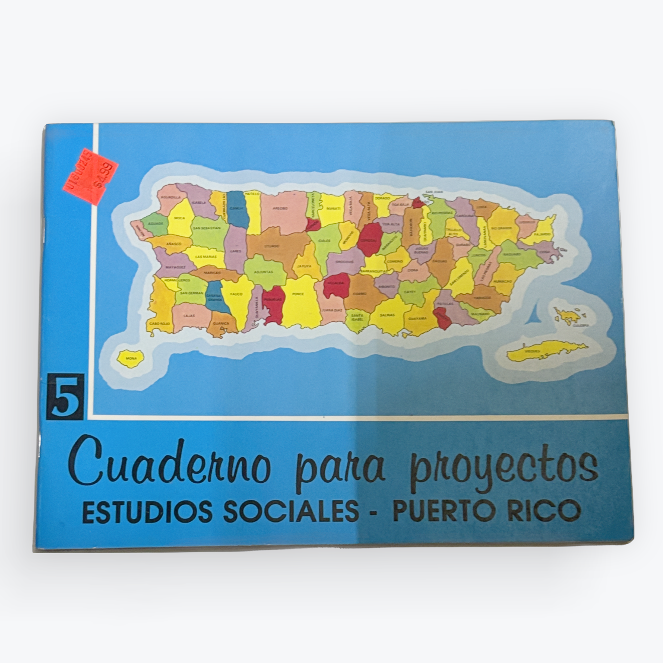 A blue project notebook cover featuring a colorful map of Puerto Rico, with Spanish text reading 'Cuaderno para proyectos' and 'ESTUDIOS SOCIALES - PUERTO RICO'.