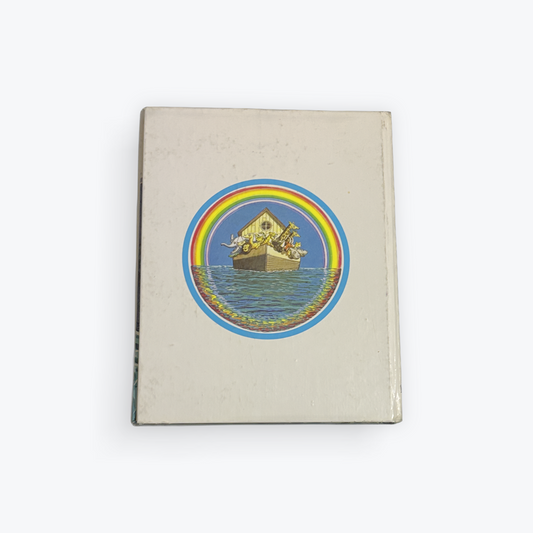A vintage hardcover notebook or journal with a beige cover, featuring a circular retro illustration of Noah's Ark on the front.