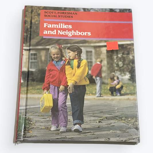 A hardcover book titled 'Families and Neighbors' by Scott Foreman, Social Studies, shown standing upright on a light gray background.