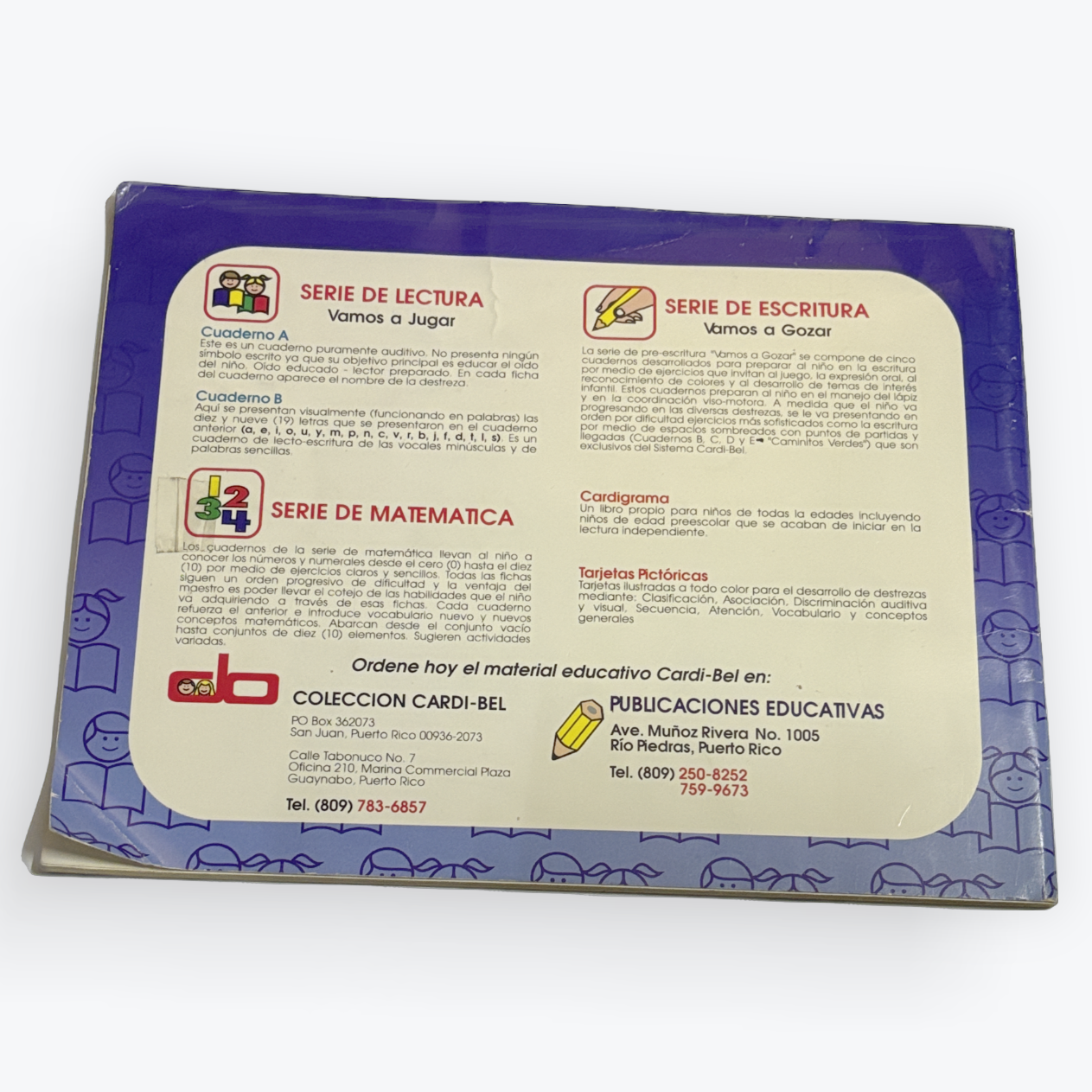 A book or booklet shown from the back, featuring a purple border and a large cream-colored central panel with Spanish text, educational symbols, and publisher branding.
