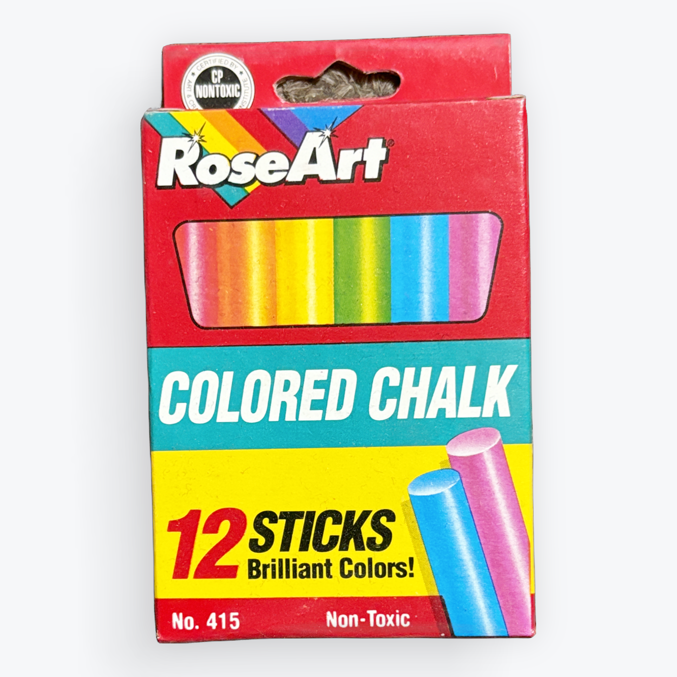 A package of RoseArt colored chalk containing 12 sticks in various bright colors, shown on a clean white background.