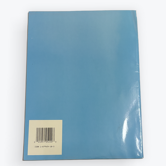 The back cover of a glossy blue notebook or book, featuring a white square label with a barcode near the bottom left, set against a plain white background.